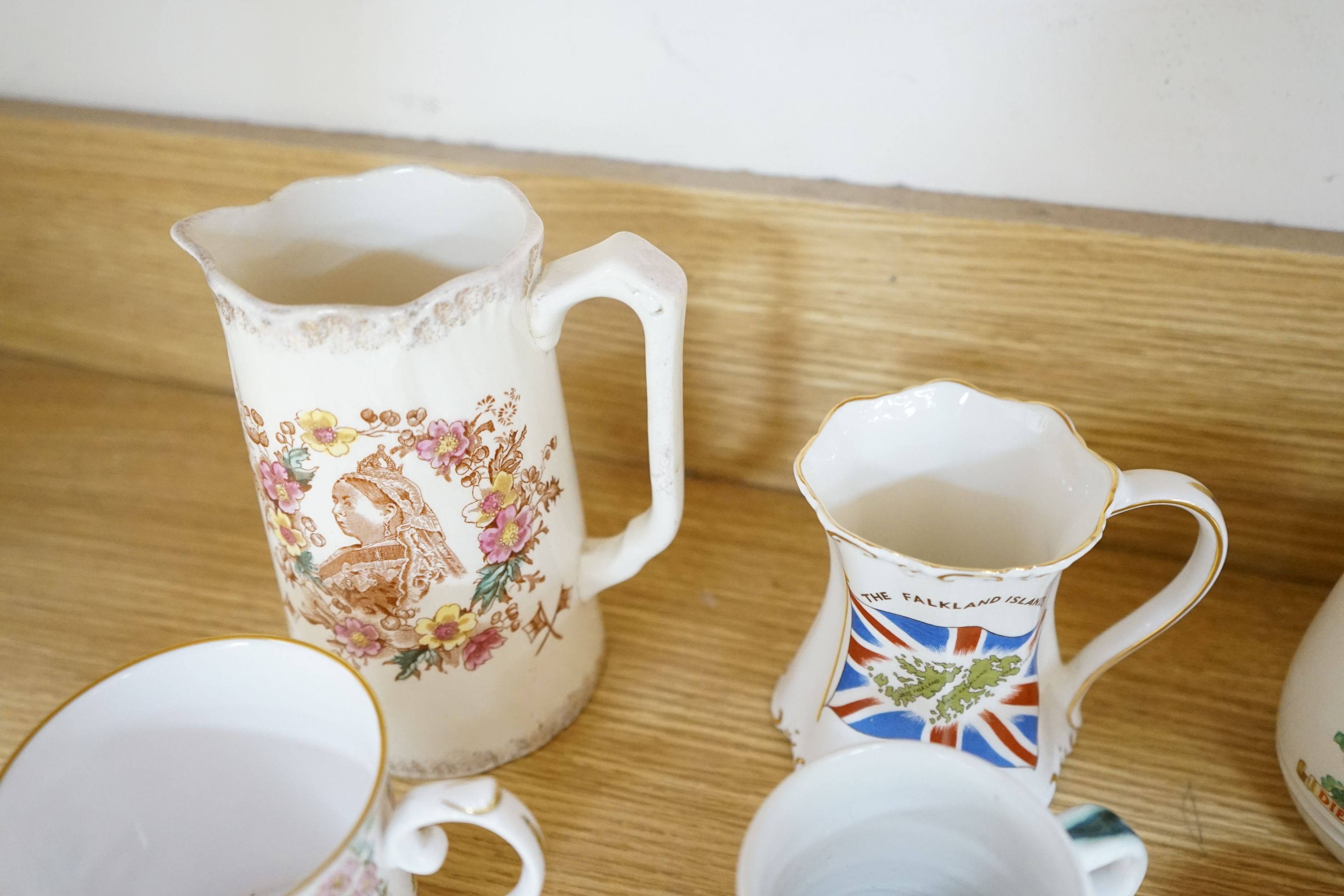 Royal commemorative ceramics and five mid 19th century Staffordshire porcelain models of cottages, etc.